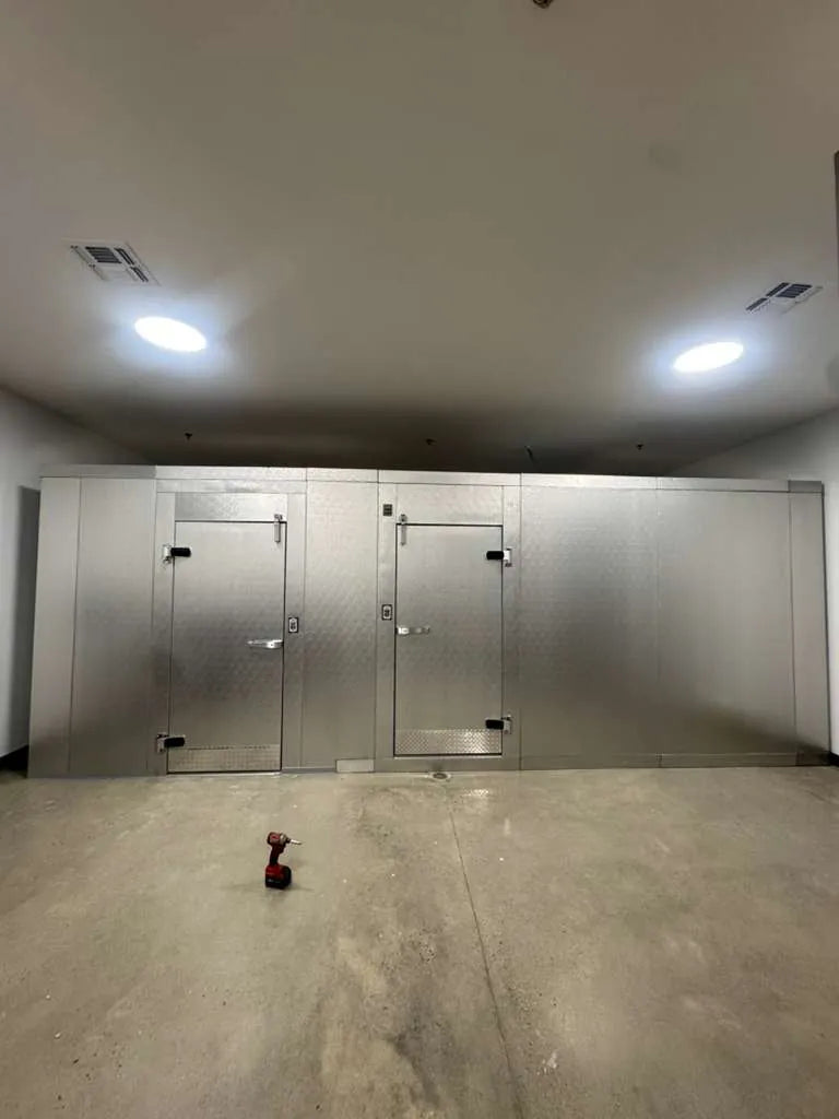 Combination walk-in cooler and freezer with two doors
