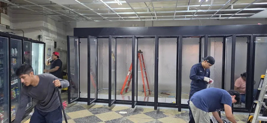 Installation crew fitting a beverage door wall