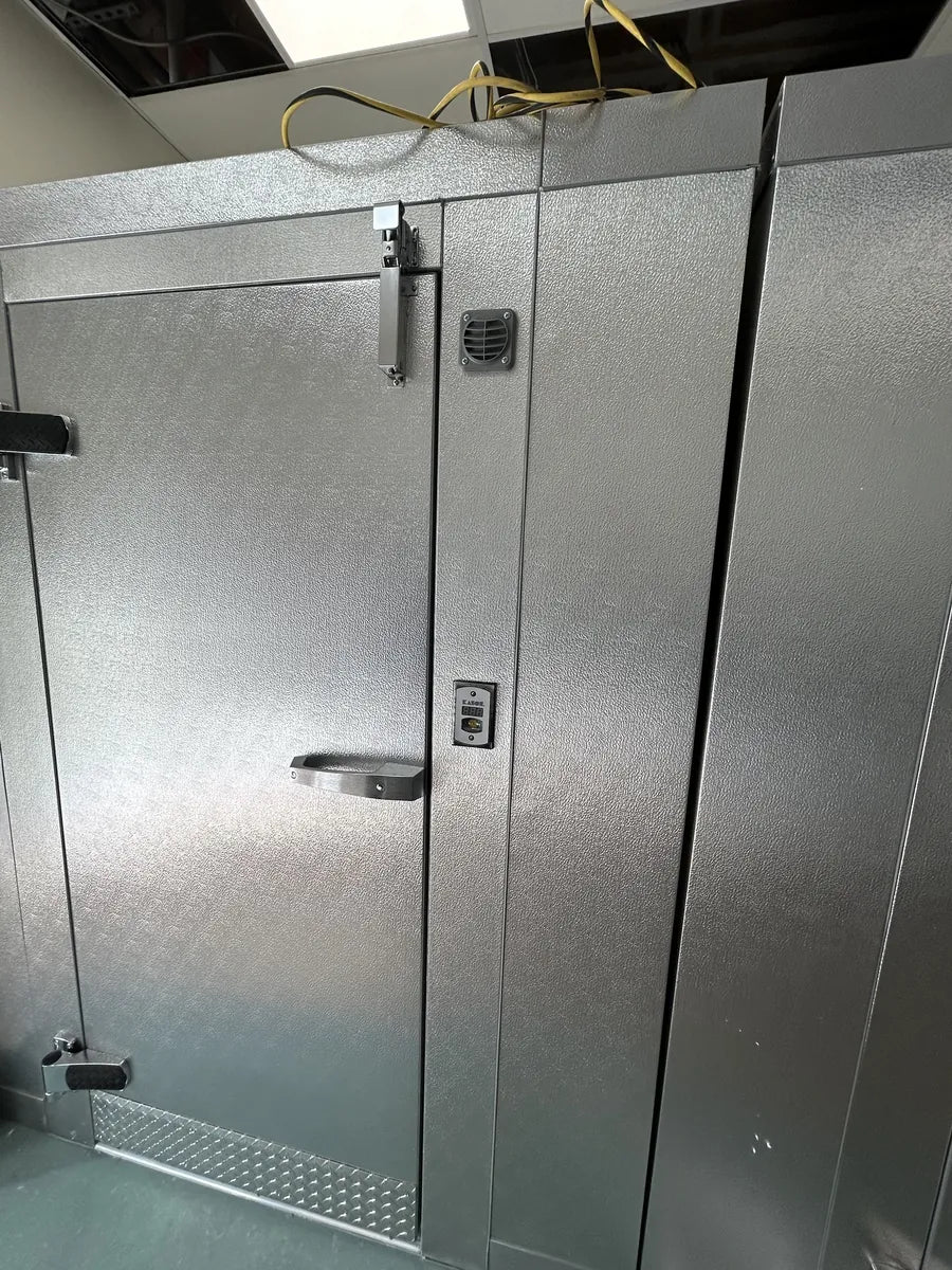Narrow walk-in cooler fitted into a tight space